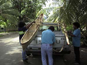 Lupalik, Berlin, and Nena tie the canoe on the truck