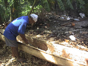 Clyde Nena working on a canoe